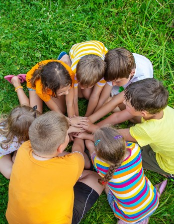 Children are playing with their hands clasped together. Selective focus. Kids.